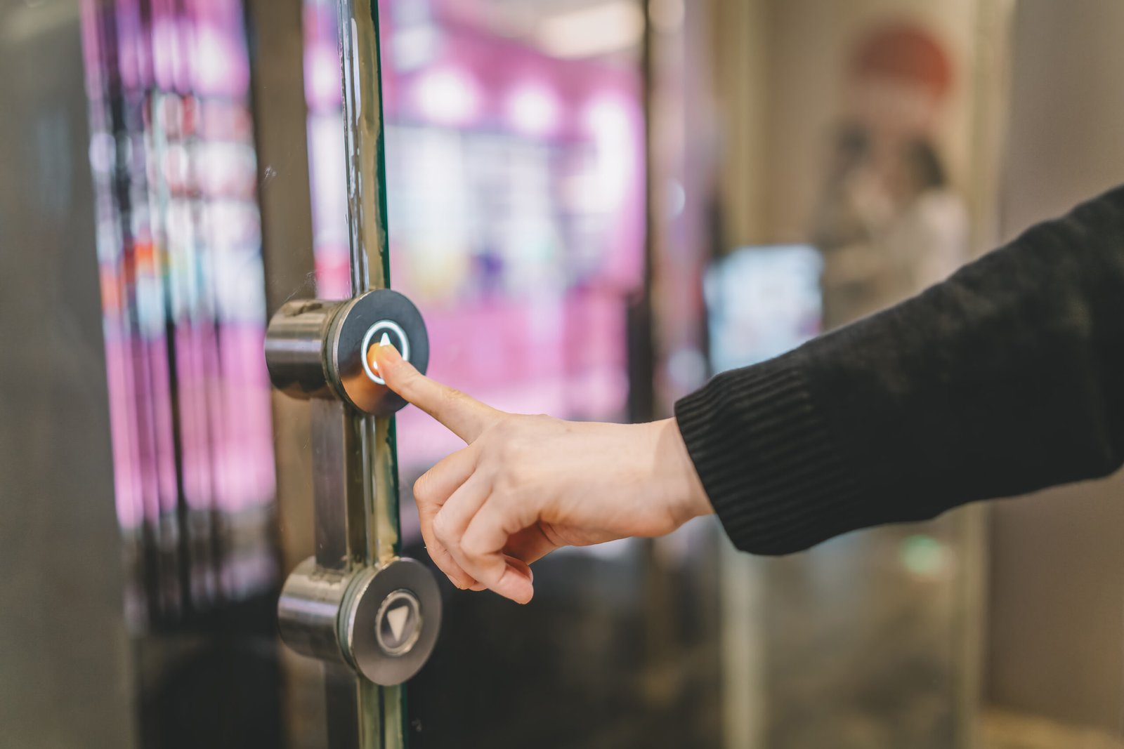 Engaging with Automatic Doors: A Hand Reaches for the Push Button